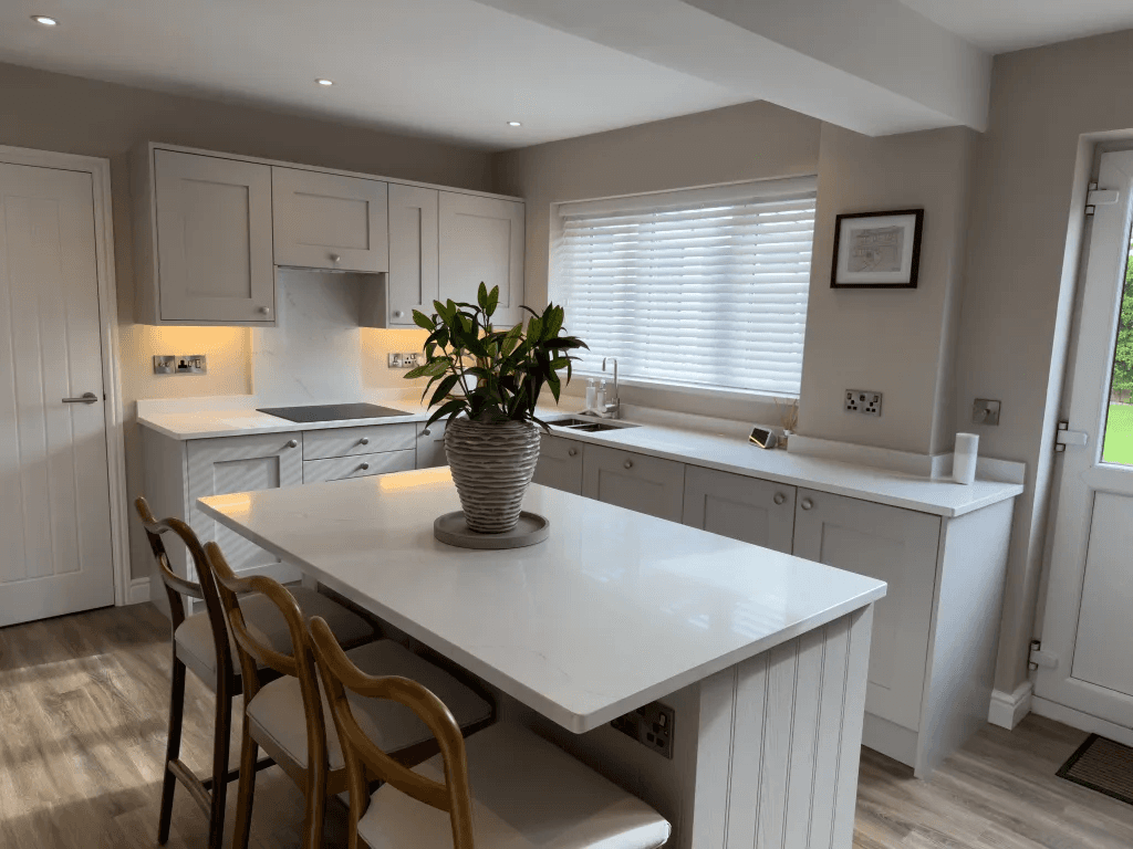 A bright kitchen with fitted cabinetry and a central island