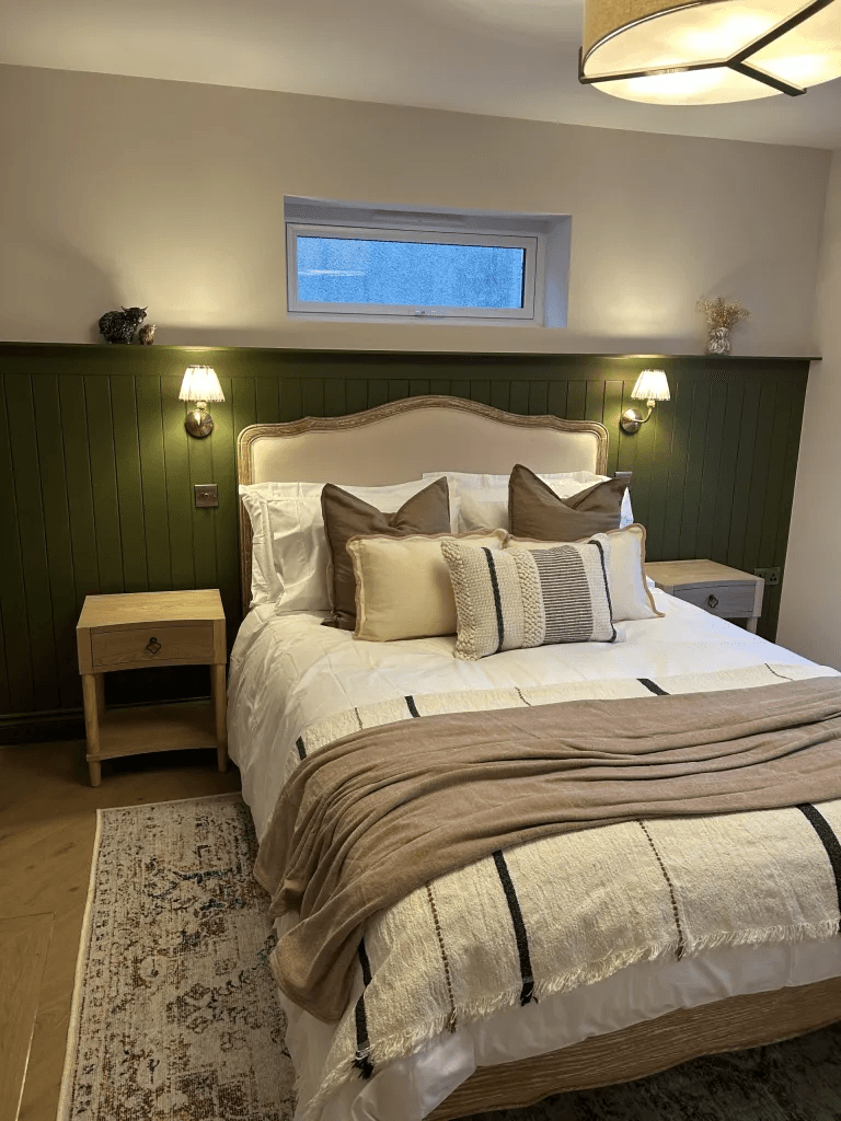 A renovated bedroom with timber wall panelling